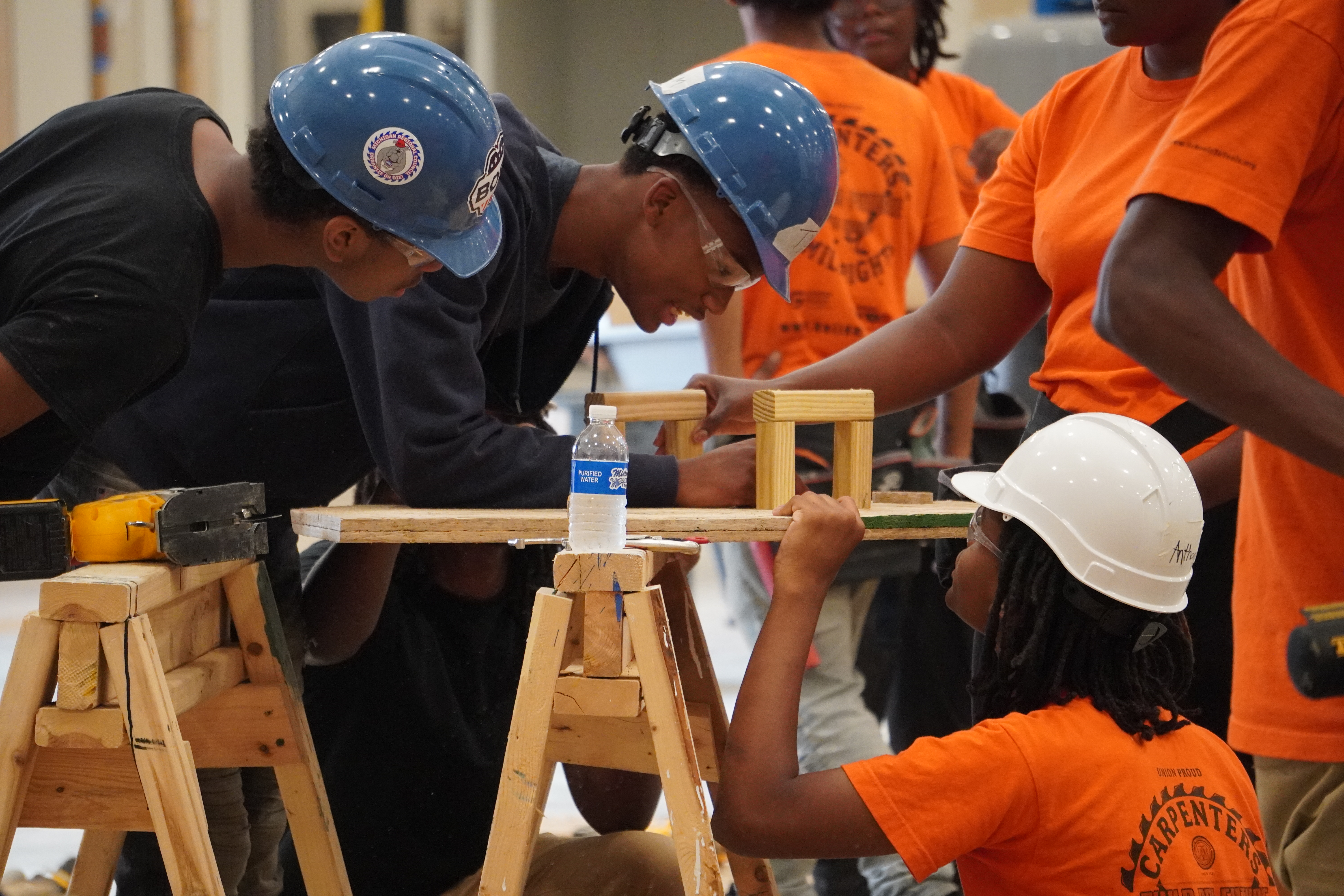 Summer campers build a project.